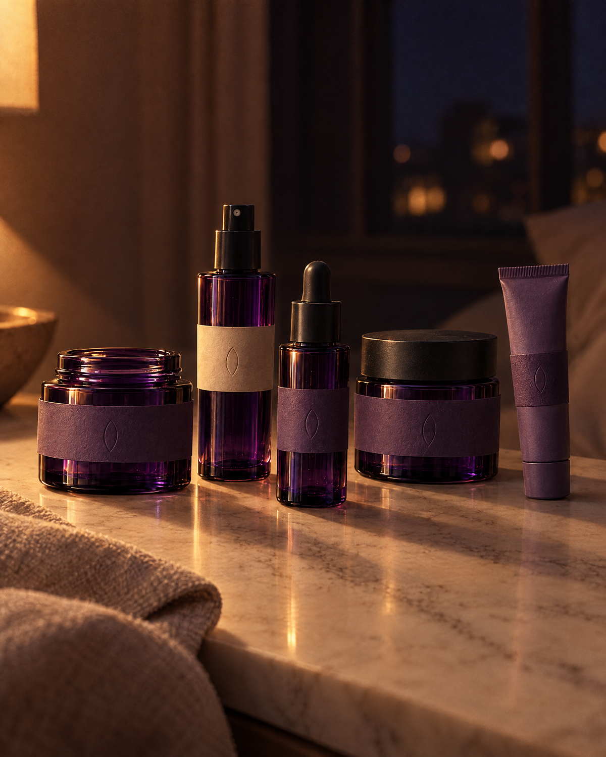 The five night bottles on a marble bedside surface by lamplight